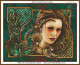 cross stitch pattern of a woman's face with ornate decorative elements and a green textured background