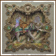 cross stitch pattern of an ornately decorated elephant with a colourful saddle framed by an elaborate gold and jewel embellished border
