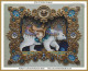 Cross-stitch pattern of a highly detailed, ornate artwork featuring a central depiction of a white bear wearing a decorative Victorian-style harness. The bear is situated within an intricate, symmetrical frame composed of swirling golden patterns adorned with blue jewels and medallions. The bear's harness is elaborately embellished with shades of lavender, gold, and teal, with hanging trinkets. The entire composition is rich in texture and color, giving an impression of depth and luxury.