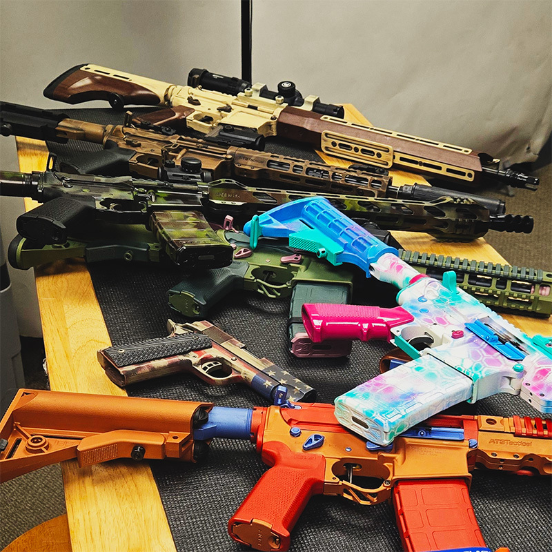 Assortment of AR15 ART Guns on Table - STNGR