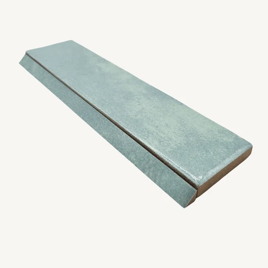 Rondine Marrakech Seawater trim paired with coordinating 2x8 field tile