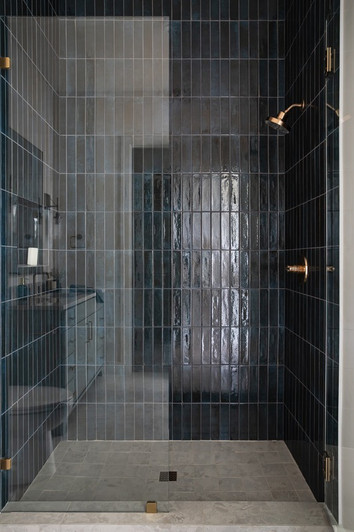 Moody residential shower featuring Soho Blue Porcelain Brick on the walls