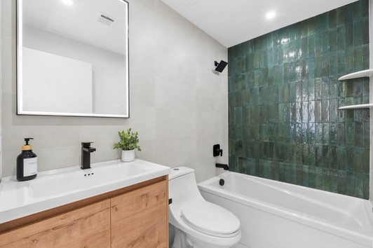 Modern Green and Neutral Bathroom by Behman Builders in NJ