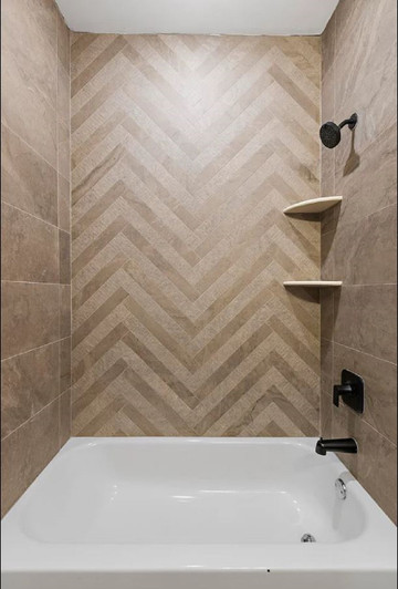Bath featuring 2x24 Minimal Chocolate Ruled combined with Minimal Chocolate laid in a herringbone pattern