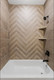 Bath featuring 2x24 Minimal Chocolate Ruled combined with Minimal Chocolate laid in a herringbone pattern