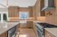 Kitchen Backsplash featuring Homey Stripes Powder with Warm toned wood cabinets