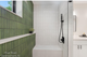 Modern Shower featuring Stripes Green and Stripes White Fluted 3D Tile