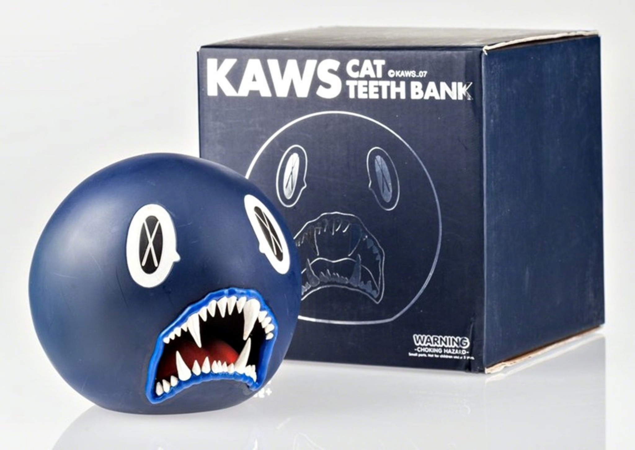 KAWS Cat Teeth Bank OriginalFake カウズ 貯金箱 KAWS, Cat Teeth Bank (Navy Blue) in original box, 2007