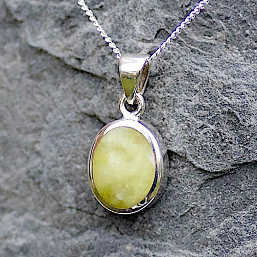Hand crafted oval yellow connemara marble pendant on sterling silver chain