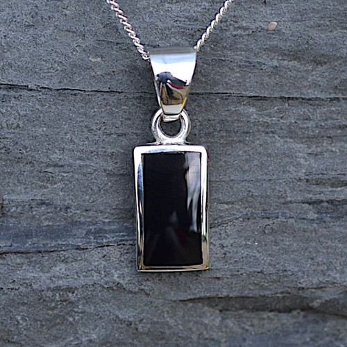 Contemporary solid silver oblong pendant with hand carved organic black gemstone