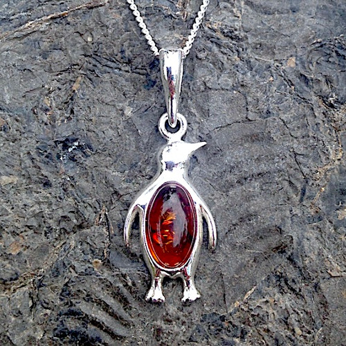 Contemporary Baltic cognac amber sterling silver penguin pendant necklace