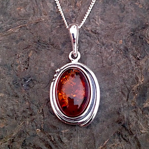 Classic sterling silver oval pendant necklace with Baltic cognac amber cabochon