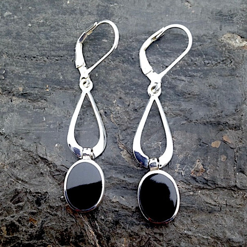 Hand crafted long sterling silver drop earrings with oval Whitby Jet stones