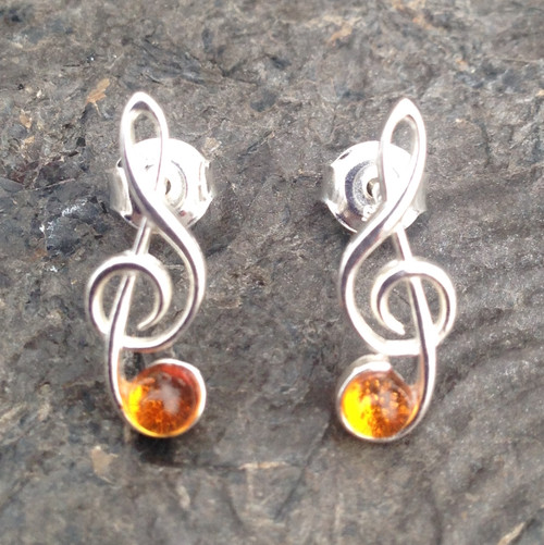 Sterling silver treble clef stud earrings with Baltic amber cabochons