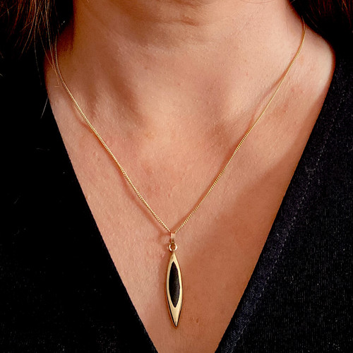 Handmade long deep gold marquise pendant with shiny black organic gemstone
