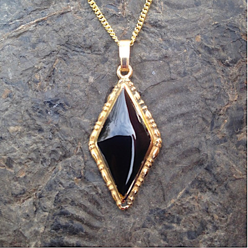 Hand crafted Whitby Jet and 9ct gold diamond shaped pendant on gold curb chain