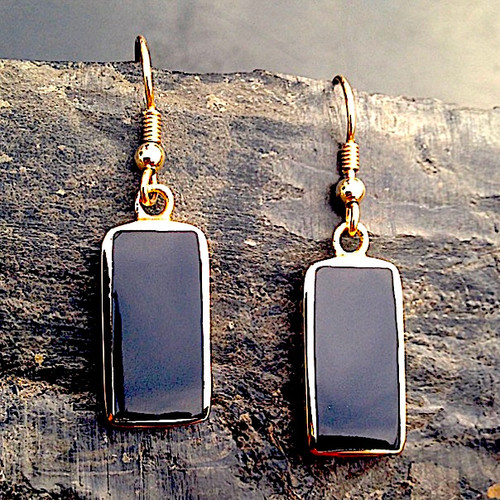 Large 9ct gold drop earrings with oblong shiny black gemstones and heart detailing