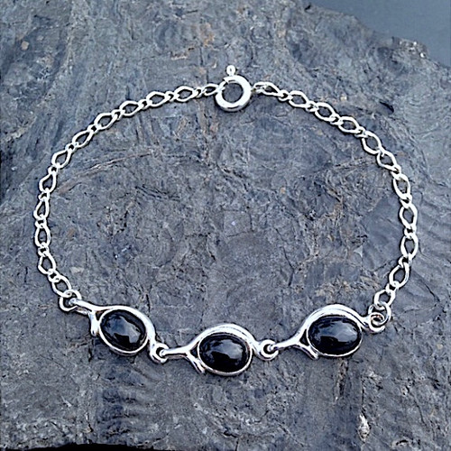 Handcrafted Sterling silver bracelet set with three Whitby Jet oval cabochons