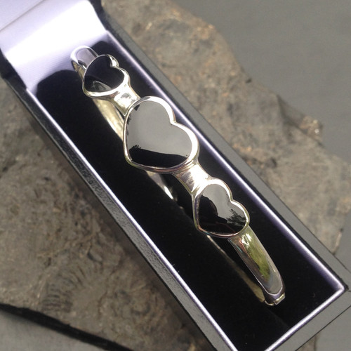 Sterling silver bangle with three hand carved Whitby Jet heart stones