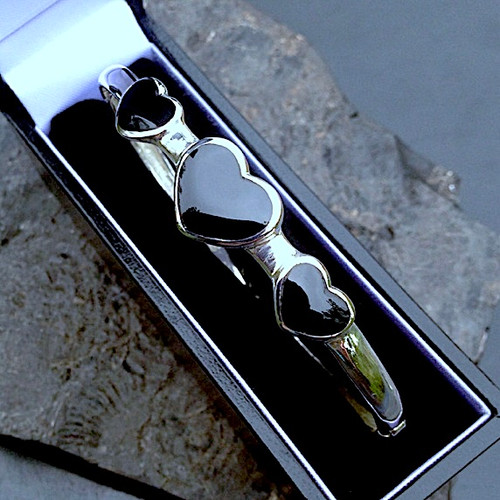 Sterling silver bangle with three hand carved Whitby Jet heart stones