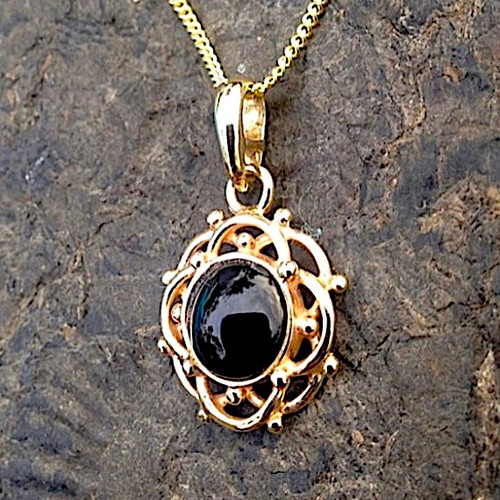 9ct gold frill and bead circular pendant with round hand cut Whitby Jet cabochon