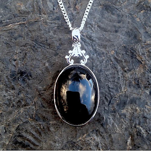 Unique reversible large oval Whitby Jet and pink rhodochrosite cabochon pendant Unique reversible large oval Whitby Jet and pink rhodochrosite cabochon pendant