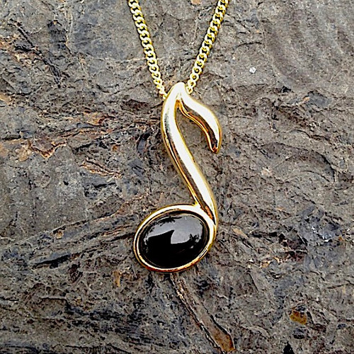 Hand crafted Whitby Jet 9ct gold music pendant with gold curb chain