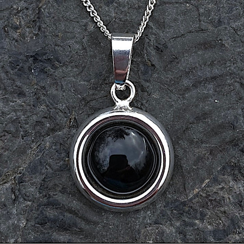 Round sterling silver necklace with hand carved Whitby Jet cabochon