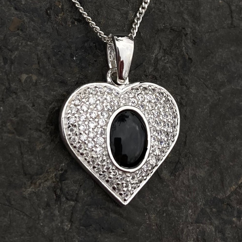 Sparkly sterling silver heart pendant with oval organic shiny black gemstone