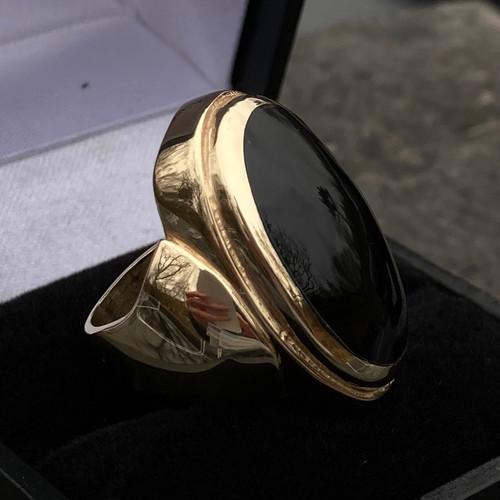 Handmade gold ring with hand cut and polished organic black gemstone