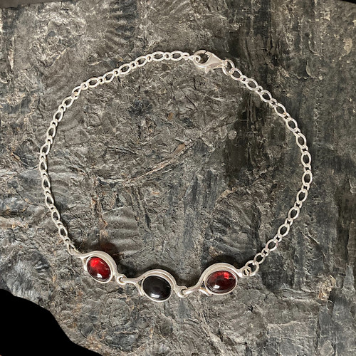 Hand crafted three stone 925 silver bracelet with garnet and jet cabochons
