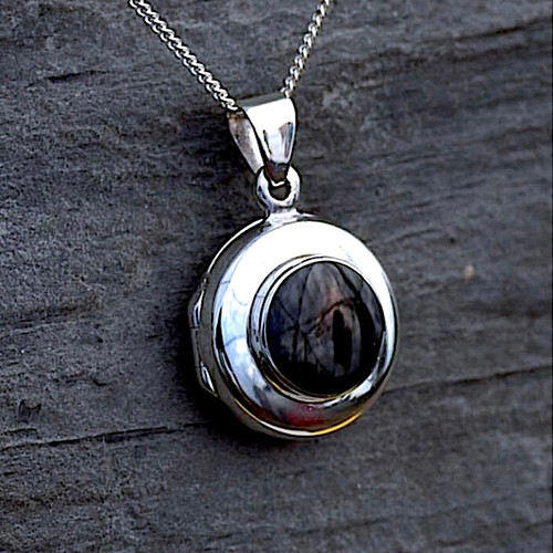 Classic circular Whitby Jet and sterling silver locket pendant necklace