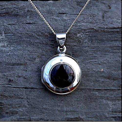 Hand crafted round locket with natural black gemstone with sterling silver frame
