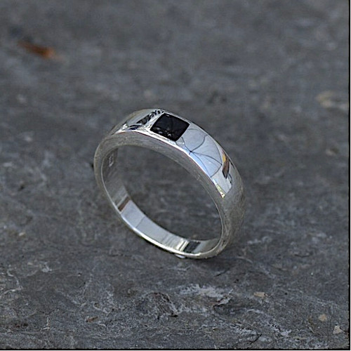 Contemporary sterling silver ring set with flush set square Whitby Jet stone