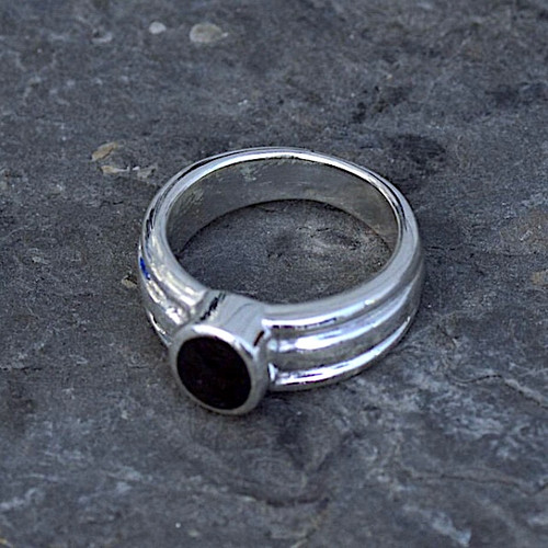 Hand crafted wide sterling silver ring with oval Whitby Jet stone and ribbed band