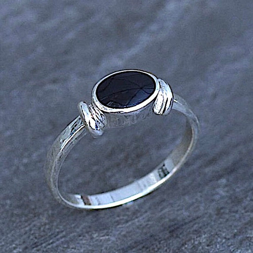 Contemporary sterling silver ring with oval Whitby Jet stone and ribbed shoulder