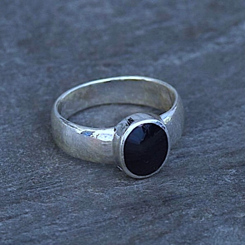 Wide sterling silver ring with hand cut oval Whitby Jet stone