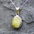 Hand crafted oval yellow connemara marble pendant on sterling silver chain