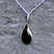 Curved Whitby Jet teardrop pendant necklace with sterling silver curb chain