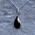 Curved Whitby Jet teardrop pendant necklace with sterling silver curb chain