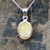 Dainty oval yellow connemara marble and sterling silver pendant