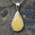 Modern butterscotch Baltic amber and sterling silver teardrop pendant