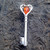 Sterling silver beaded heart key vertical pin brooch with Baltic cognac amber teardrop stone