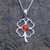 Contemporary sterling silver Baltic amber four leaf clover pendant necklace 