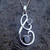 Contemporary sterling silver swirl pendant two hand carved round Whitby Jet stones