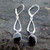 Hand crafted long sterling silver drop earrings with oval Whitby Jet stones