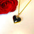 9ct gold love heart necklace with shiny organic black gemstone in gift case