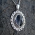 Large oval sterling silver and Whitby Jet intricately detailed filigree pendant