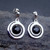 Spiral shaped sterling silver and Whitby Jet cabochon drop earrings with stud fastenings
