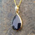 Hallmarked Whitby Jet and 9ct gold pear drop pendant with solid gold reverse